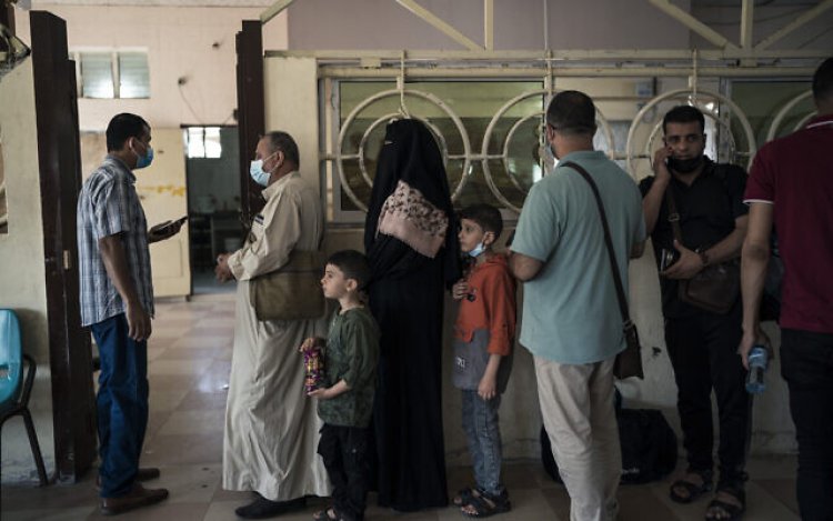 Palestinians wait to travel to Egypt after Gaza crossing reopening