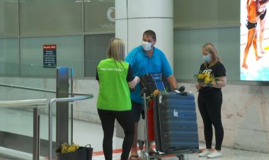 Flowers, cheers and tears as Australia's border reopens