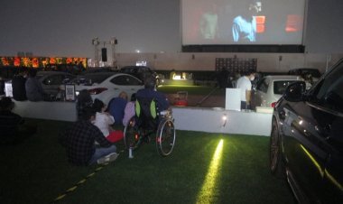 Drums, cake and milk as Indian cinemas dance back to life