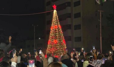 Palestinians celebrate lighting of Christmas tree in Gaza