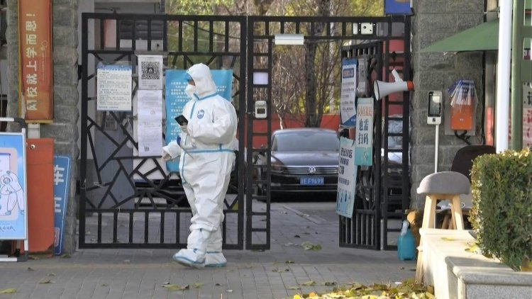 China says tracking Covid cases now 'impossible' as infections soar