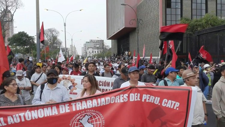Supporters of Peru's ousted president march